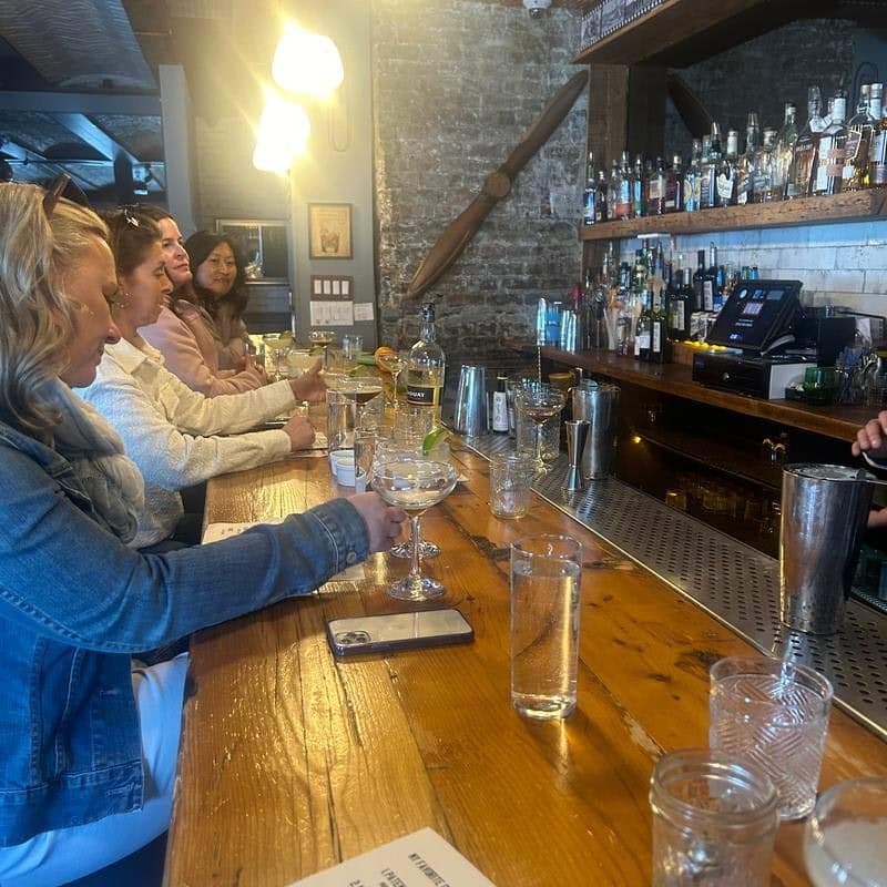 Guests enjoying drinks at the bar